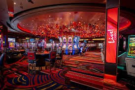 tangkasqq mobile app interface showing live football and casino games on Android phone